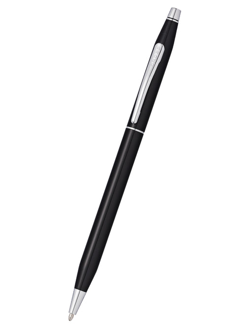 A slim bodied Cross ballpoint pen with black lacquer and precious metal details.